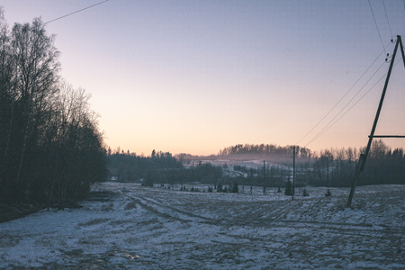 frozen countryside scene in winter with snow. beach scene with iceの写真素材