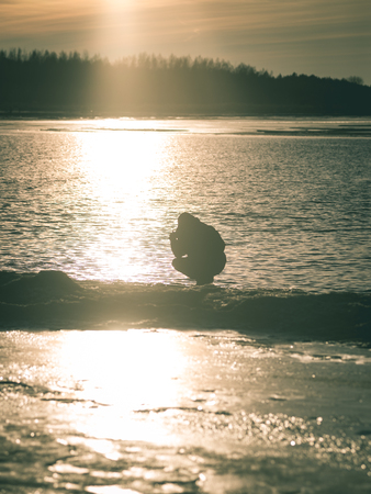 people enjoying frozen beach in winters cold. walking and relaxingの写真素材