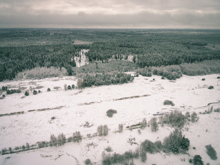 aerial view of winter forest covered in snow. drone photography - vintage effectの写真素材