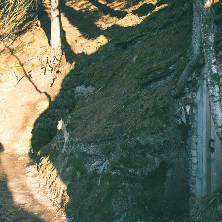 rural scenery in winter with sandstone cliffs and tourist trails. Gauja National Park. Latvia - instant vintage square photoの写真素材
