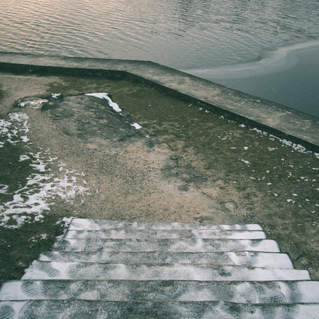 icy rural landscape with trees and land in countryside - instant vintage square photoの写真素材