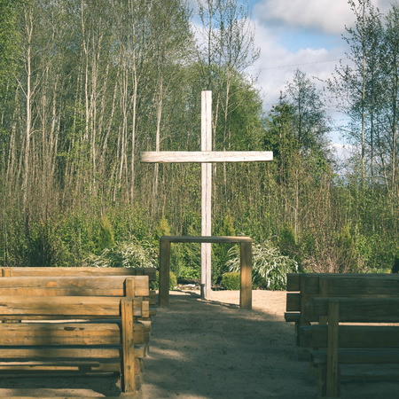 open air church in latvia with large cross - instant vintage square photoの写真素材