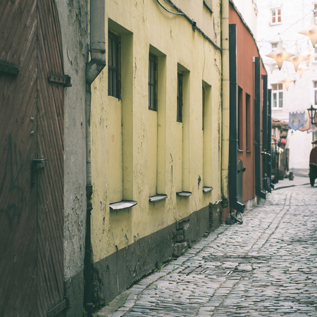 architectural details in spring of old city center in Riga, Latvia - instant vintage square photo
