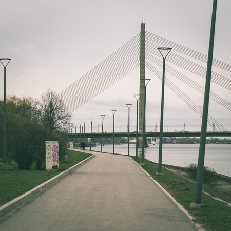 panoramic image of Riga shoreline with river Daugava and bridges, Riga, Latvia, april 15th 2015 - instant vintage square photoの写真素材