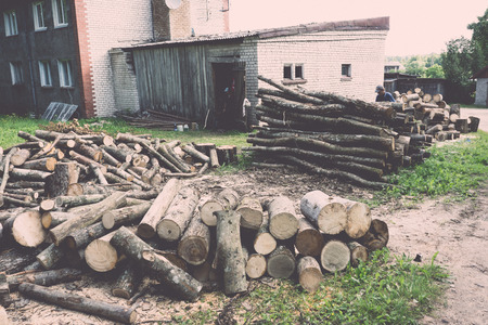 wooden log storage place for heating - vintage retro lookの写真素材