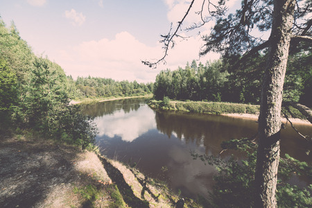 Mountain river with Flowing Water Stream and sandstone cliffs - retro, vintage style lookの写真素材
