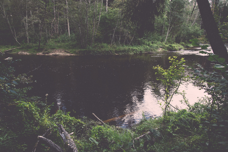 Mountain river with Flowing Water Stream and sandstone cliffs - retro, vintage style lookの写真素材