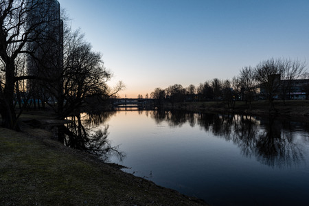 city light reflections over water at the night. colorful panorama of Riga, Latviaの写真素材