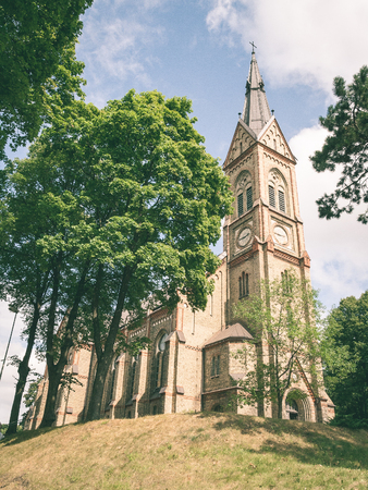 old church building details. gothic architecture and rock fundament - vintage green look