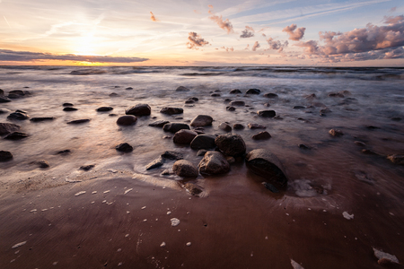 View of a rocky coast beach in the morning. Long exposure shot. Latviaの写真素材