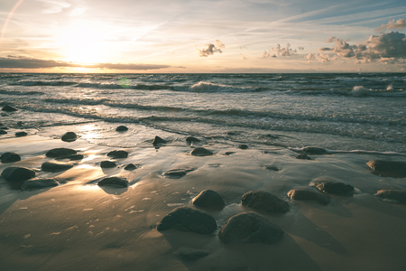View of a rocky coast beach in the morning. Long exposure shot. Latvia - vintage effectの写真素材