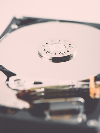 computer hard disk drive close-up shot. shallow depth of field. macro - retro vintage effect