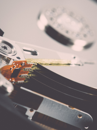 computer hard disk drive close-up shot. shallow depth of field. macro - retro vintage effectの写真素材