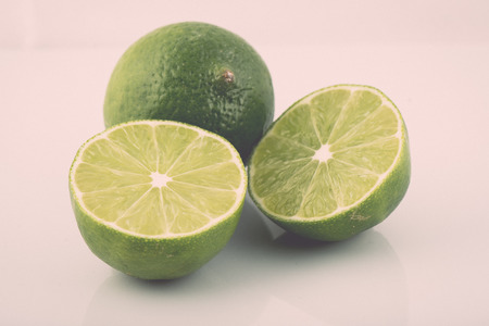 slice of lime isolated on white background - retro vintage film effectの写真素材