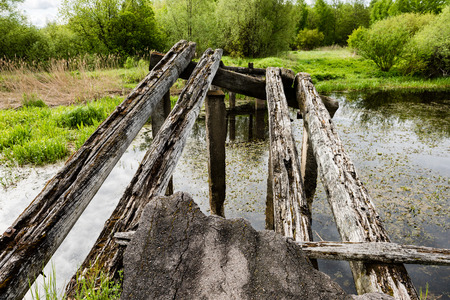 old bridge over the river in countryside of Latviaの写真素材