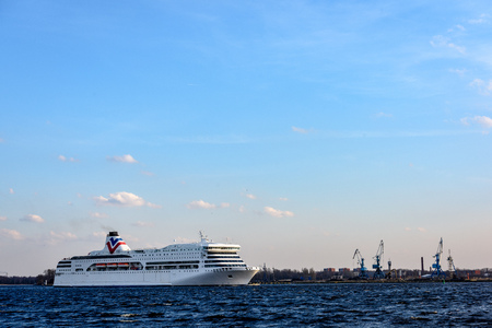 white sea ferry leaving the port of Riga in Latviaのeditorial素材