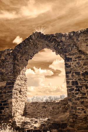 infrared camera image colored. old stone castle ruins in Koknese, Latviaの写真素材