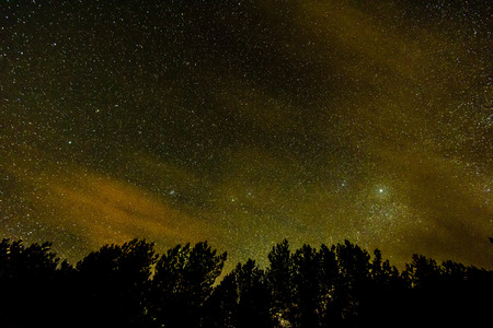 Intense northern lights (Aurora borealis) over Baltic sea. rocky beach