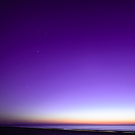 night sky with stars and milky way over beach