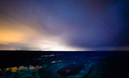 night sky with stars and milky way over beach