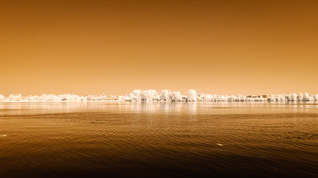 panoramic view of Riga, Latvia over the river Daugava in sunny day. autumn colors. infrared imageの写真素材
