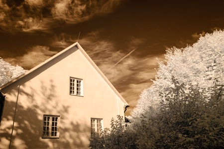 public forest park view in Turaida Sigulda, Latvia with contrasty clouds above and ruins of old castle. infrared imageの写真素材