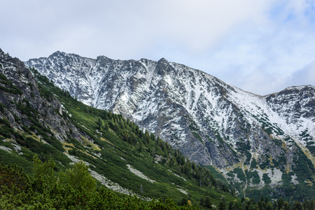panoramic view of Tatra mountains in Slovakia covered with snow and hiding in mist. high altitudeの写真素材