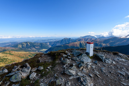 Sunny hill tops in summer. mountain border between Poland and Slovakia border markers from stoneの写真素材