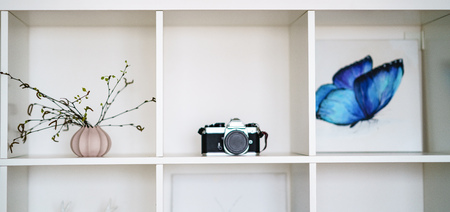 wedding decorations theme, flowers and champagne in white interior. vintage film cameraの写真素材