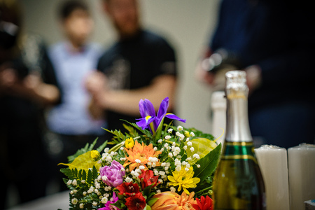 wedding decorations theme, flowers and champagne in white interior. bottle of champagne and glassesの写真素材