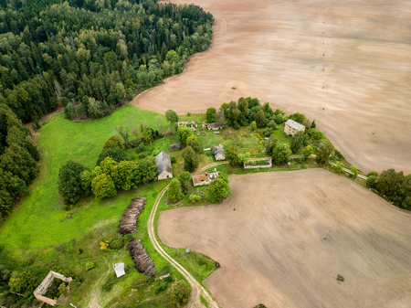 drone image. aerial view of rural area with fields and forests in cloudy spring day. latviaの写真素材