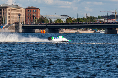 Riga, Latvia, August 19, 2007 - river boat championship in river Daugava, speedboats on water and old city in backgroundのeditorial素材