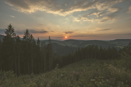 beautiful sunset in the mountains of Tatra, slovakia. hill tops with red clouds over them.  Western carpathian - vintage retro lookの写真素材