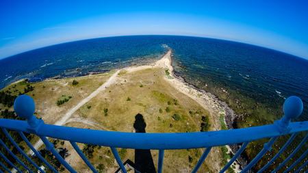 fisheye lens view of the island of Hiiumaa in Estonia from lighthouse with white rails in clear dayの写真素材