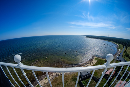 fisheye lens view of the island of Hiiumaa in Estonia from lighthouse with white rails in clear dayの写真素材