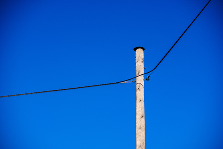 power line electricity poles in country with wiresの写真素材