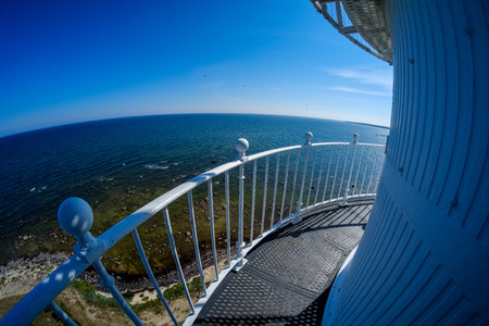 fisheye lens view of the island of Hiiumaa in Estonia from lighthouse with white rails in clear dayの写真素材