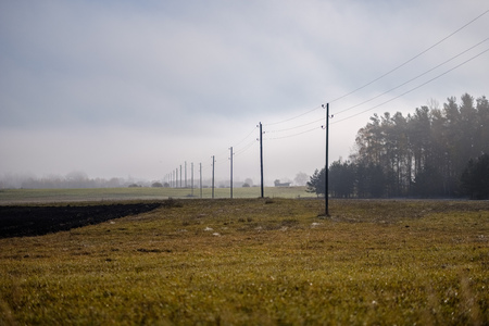 power line electricity poles in country with wiresの写真素材