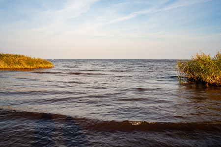 sea beach skyline with clouds and calm water. colorful scenery