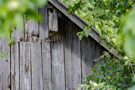 old wooden barn details in countryside at summer with old planks and metal details
