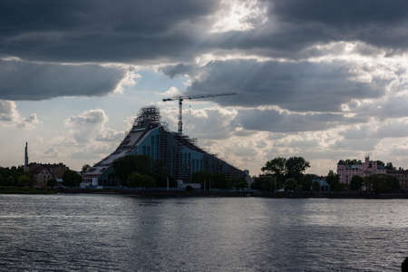 Riga city, capital of Latvia panoramic view with river Daugava and cable bridge with calm water in summerの写真素材