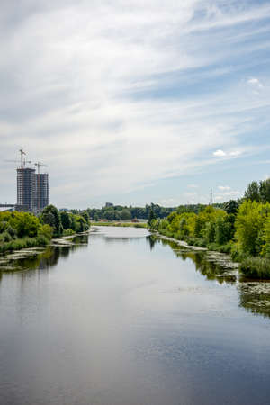 Riga city, capital of Latvia panoramic view with river Daugava and cable bridge with calm water in summerの写真素材