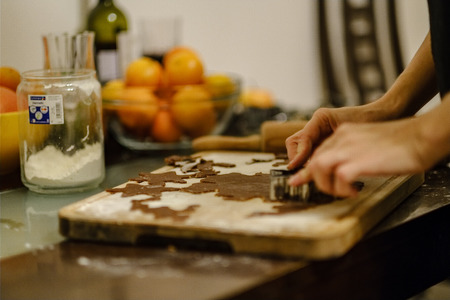 Making Gingerbread Cookies Series. Preparing and cutting dough sheet into shapes.の写真素材