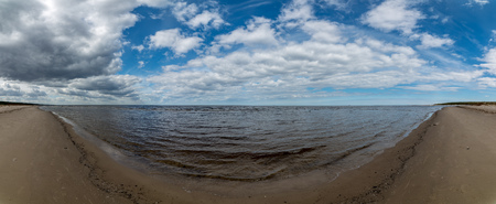 empty sandy beach by the sea. naked winter shore, no people