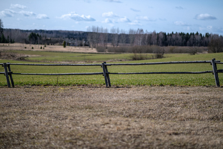 old wooden fence in countryside park with sun raysの写真素材