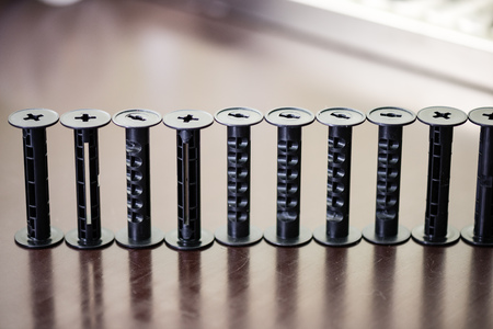 details of analog film laboratory equipment on the table. film rolls and development tank rolls with glass beaconsの写真素材
