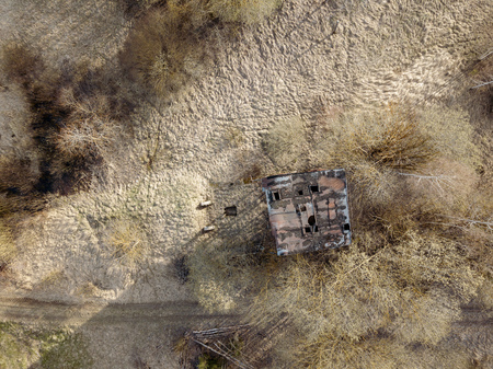 aerial view of abandoned rural housing buildings in springの写真素材