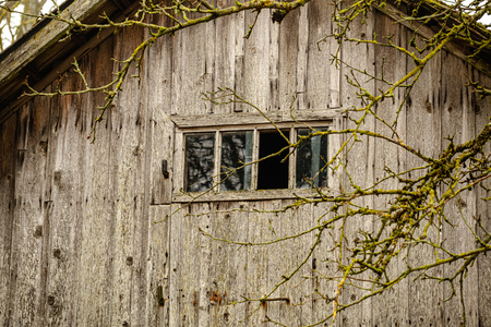 old wooden plank building structure in countryside. loneliness and silenceの写真素材