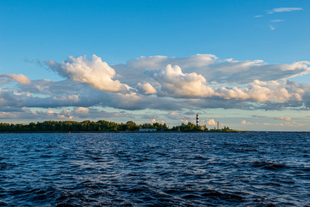 clear sky with dramatic clouds over the lake in sunset. countryside lake landscapeの写真素材