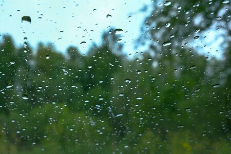 rain drops on window glass. view from inside outの写真素材